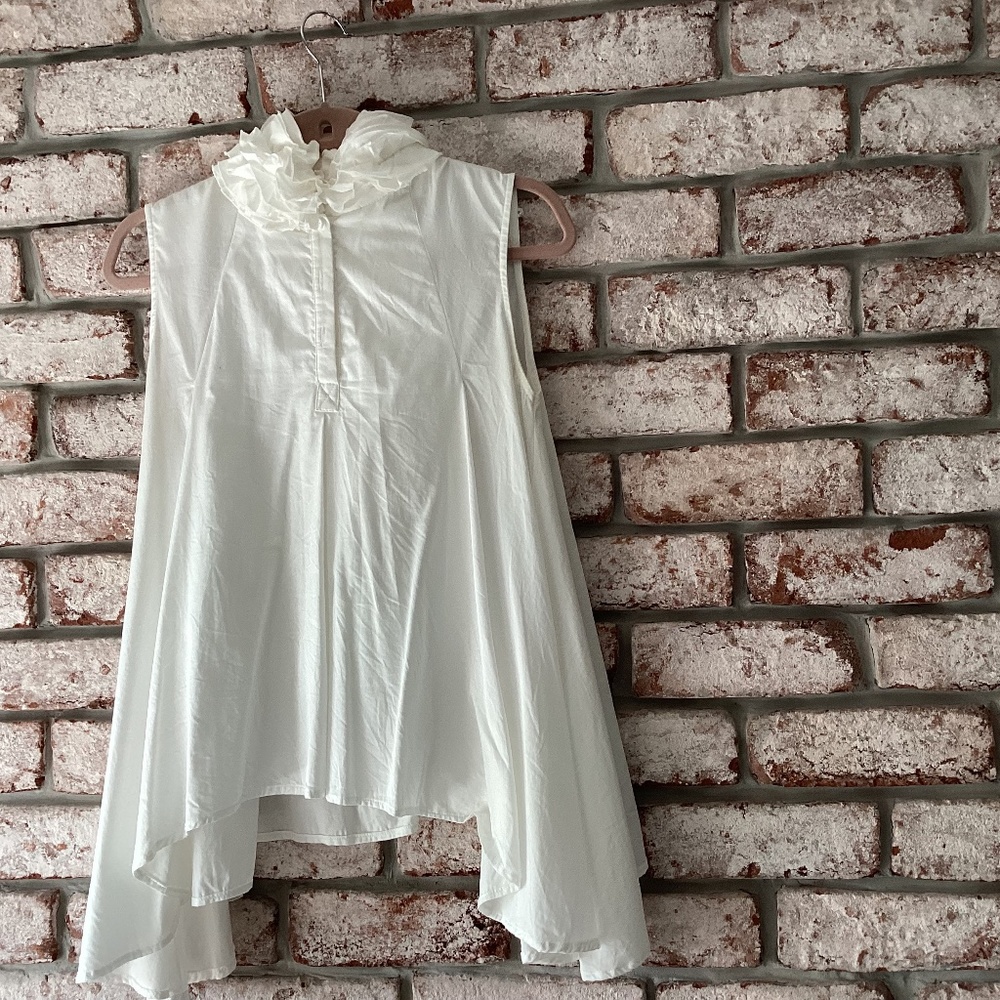Woman’s white ruffled collar top